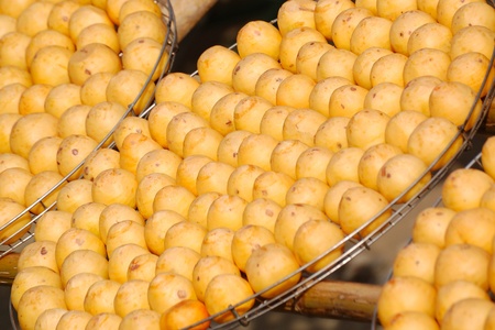 Dry persimmon under the sun. Traditional Taiwan snack and food. A spread view of gold fruit background.の写真素材