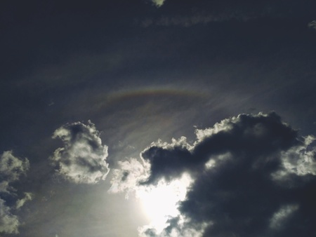 Scenic Bright Rainbow Halo Blurred by cloudsの写真素材