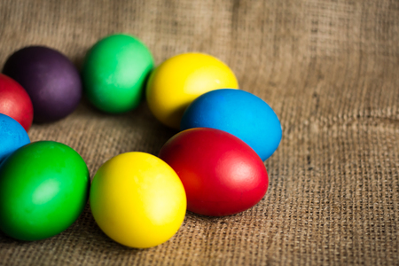 Colored Easter eggs, rustic backgroundの写真素材