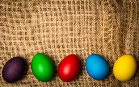 Colored Easter eggs, rustic backgroundの写真素材