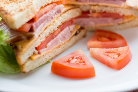 sandwich with cheese, tomato and smoked meatの写真素材