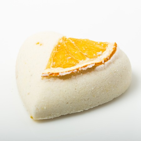 salt bath bomb decorated orange on a white backgroundの写真素材