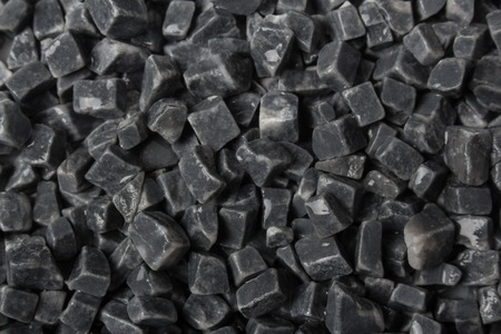 beautiful natural gray stones scattered on a white
