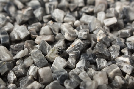 beautiful natural gray stones scattered on a whiteの写真素材