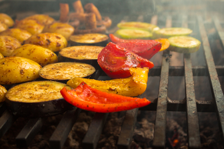 Fresh vegetables roast on a large grillの写真素材