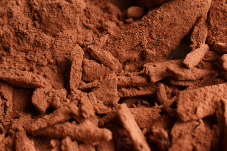 Chocolate heart-shaped candy on a rustic backgroundの写真素材