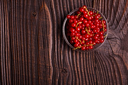 fresh red currant and jam on the rustic background.の写真素材
