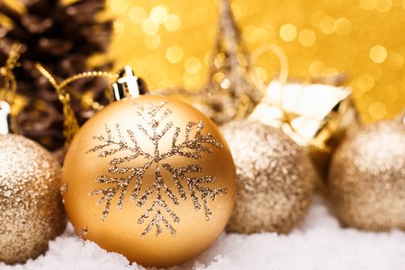 Christmas composition of Christmas tree toys on a gold background.の写真素材