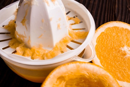 oranges and juice on a wooden background.の写真素材