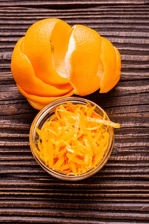 oranges and juice on a wooden background.の写真素材