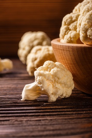 cauliflower and broccoli on a rustic background.の写真素材