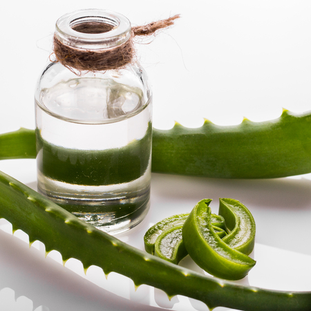 aloe essential oil on a white acrylic background.の写真素材