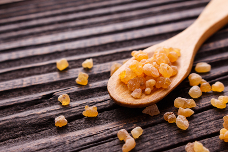 frankincense essential oil on a wooden background.の写真素材