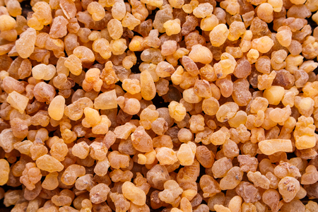 frankincense essential oil on a wooden background.の写真素材