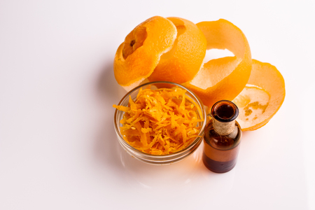 orange essential oil on a white background.の写真素材