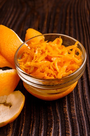 oranges and juice on a wooden background.の写真素材