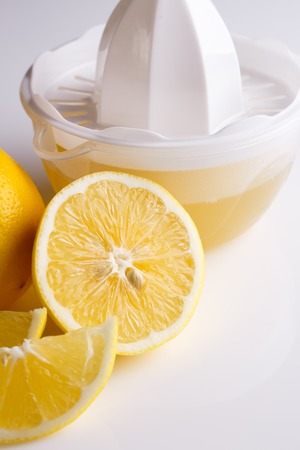 Lemon and juice on a white background.の写真素材