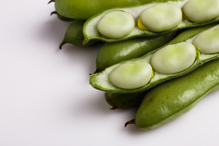 fresh broad beans on a white background.の写真素材
