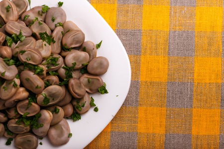 boiled broad beans on a rustic background.の写真素材