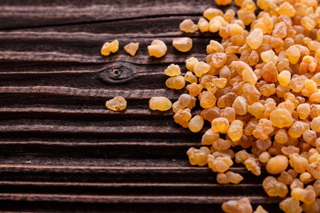 frankincense essential oil on a wooden background.の写真素材
