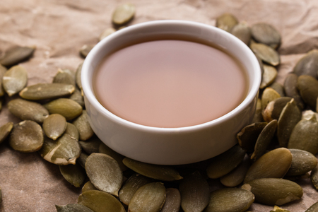 pumpkin seed oil on a rustic background.の写真素材