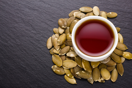 pumpkin seed oil on a rustic background.の写真素材