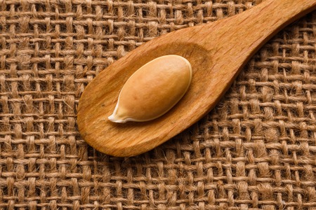 pumpkin seed oil on a rustic background.の写真素材