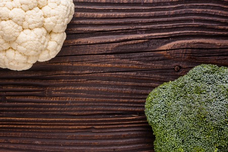cauliflower and broccoli on a rustic background.の写真素材