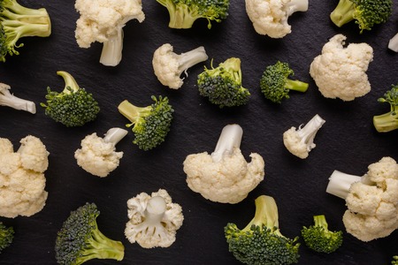 cauliflower and broccoli on a rustic background.の写真素材