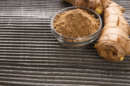 Ginger root on a gray wooden background.
