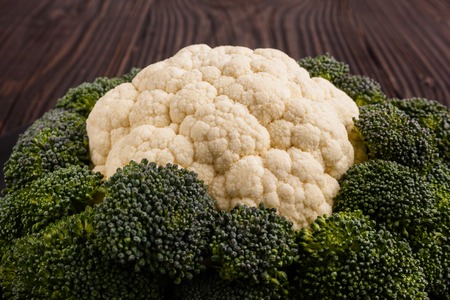 cauliflower and broccoli on a rustic background.の写真素材