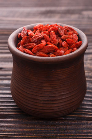 dried goji berries on a wooden rustic background.の写真素材