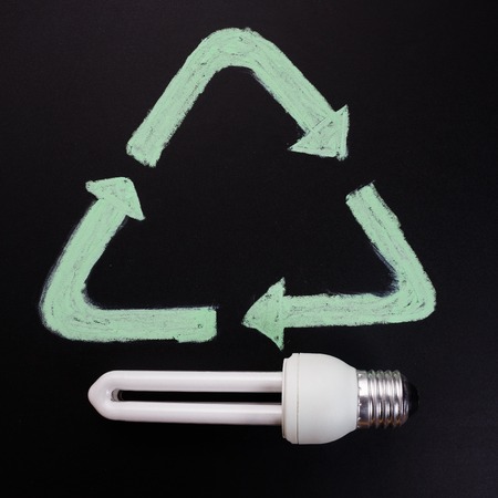 fluorescent lamp on a dark background, concept of recycling.の写真素材