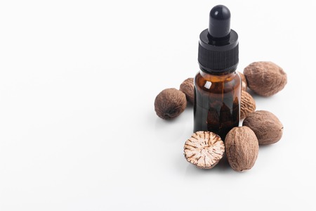nutmeg essential oil on a white acrylic background.の写真素材