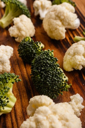 cauliflower and broccoli on a rustic background.の写真素材
