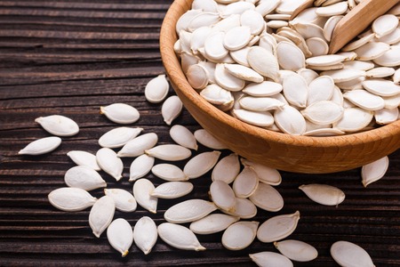 pumpkin seed oil on a rustic background.の写真素材