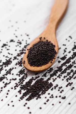 fresh amaranth grains on a rustic background.の写真素材