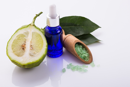 Lemon essential oil on a white background.の写真素材