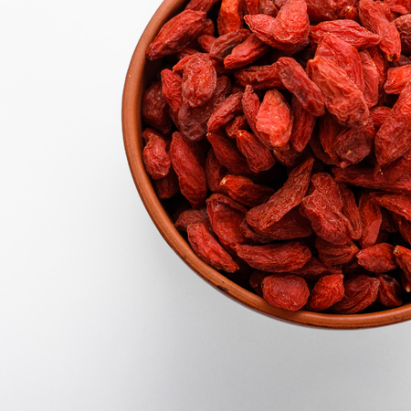 dried goji berries on a white acrylic background.の写真素材