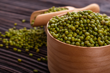 fresh Mung beans on a rustic wooden background.の写真素材