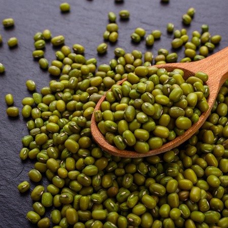 fresh Mung beans on a dark stone background.の写真素材