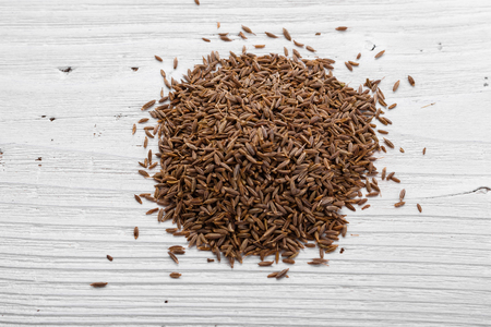 fragrant Zira on a wooden rustic background.