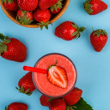 fresh strawberrysmoothie or milkshake on a delicately blue background.の写真素材