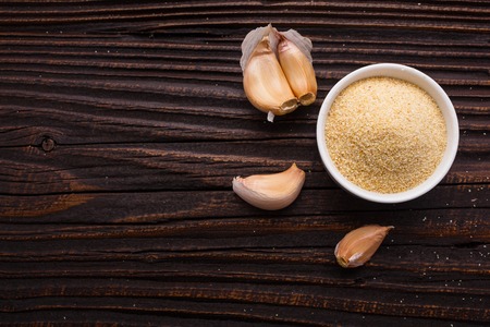 fragrant garlic on a wooden rustic background.の写真素材