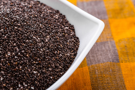 chia seeds on a light rustic background.の写真素材