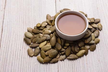 pumpkin seed oil on a rustic background.の写真素材