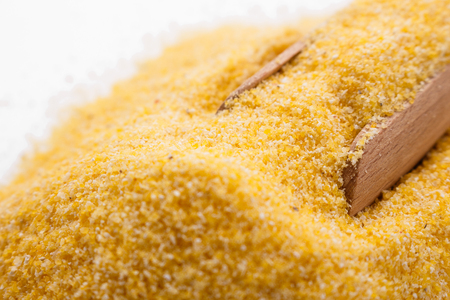 raw Italian corn porridge polenta on a white background.の写真素材
