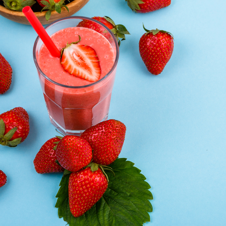fresh strawberrysmoothie or milkshake on a delicately blue background.の写真素材