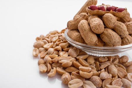 fresh peanuts on a white acrylic background.の写真素材