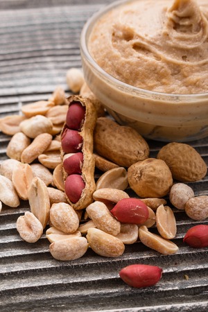 peanut paste on a wooden rustic background.の写真素材